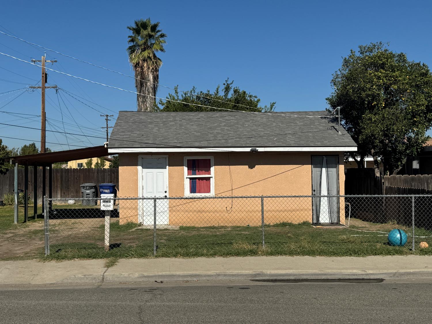 687 South 8th Street Kerman, CA 93630 - Photo 6 of 16 a view of a house with a street