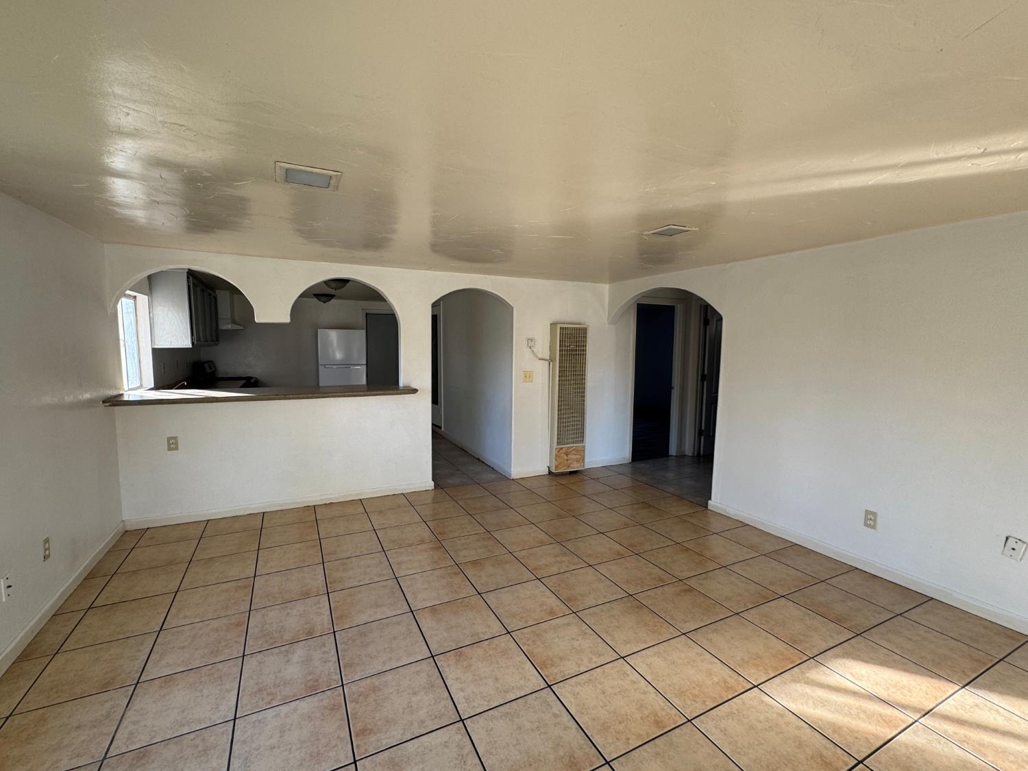 687 South 8th Street Kerman, CA 93630 - Photo 8 of 16 a view of entryway with kitchen and sink