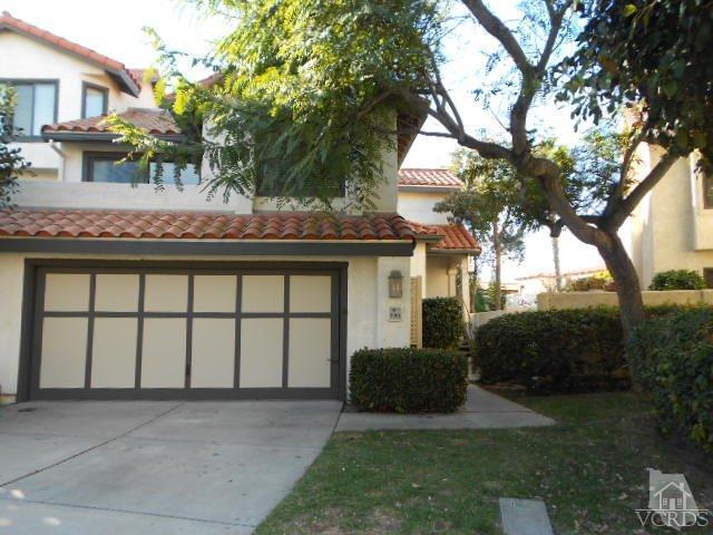 2201 Vina Del Mar Oxnard, CA 93035 - Photo 2 of 48 a view of a white house next to a yard with plants and trees