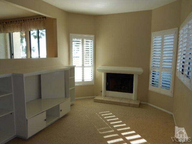 2201 Vina Del Mar Oxnard, CA 93035 - Photo 13 of 48 a living room with furniture and a fireplace