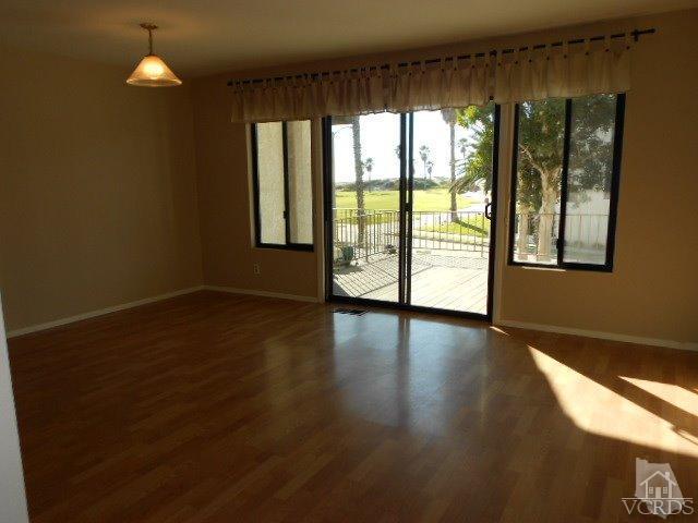 2201 Vina Del Mar Oxnard, CA 93035 - Photo 14 of 48 a view of an empty room with wooden floor and a window