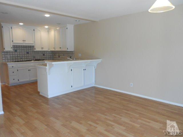 2201 Vina Del Mar Oxnard, CA 93035 - Photo 17 of 48 a large white kitchen with granite countertop a sink