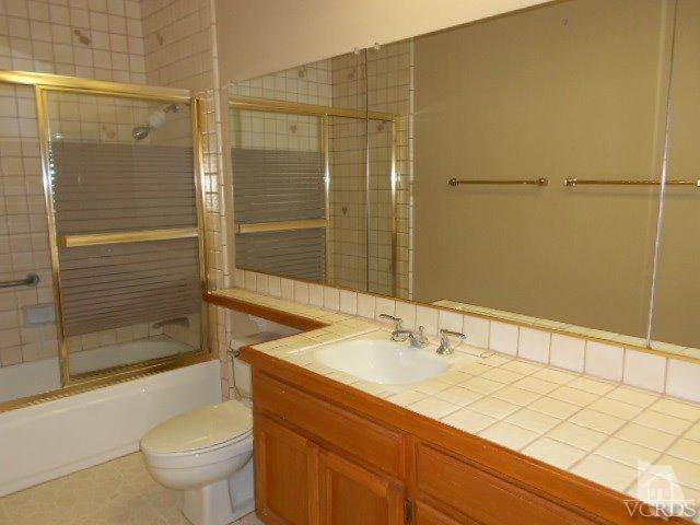 2201 Vina Del Mar Oxnard, CA 93035 - Photo 27 of 48 a bathroom with a sink and a mirror
