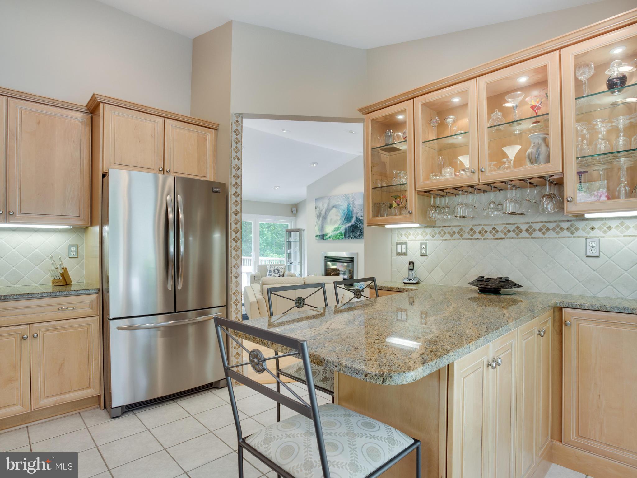 5820 Huntingtown Road Huntingtown, MD 20639 - Photo 5 of 30 Maple cabinetry w/glass fronts, island.