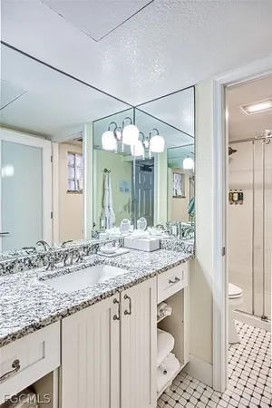 a view of a livingroom with furniture hardwood floor and a window