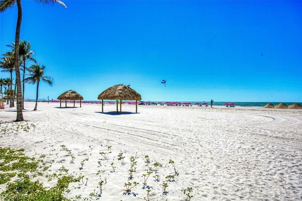 a view of building with car parked