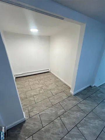 a bathroom with a bath tub with a shower