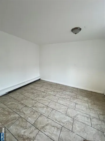 a large kitchen with kitchen island granite countertop a sink and a stove top oven
