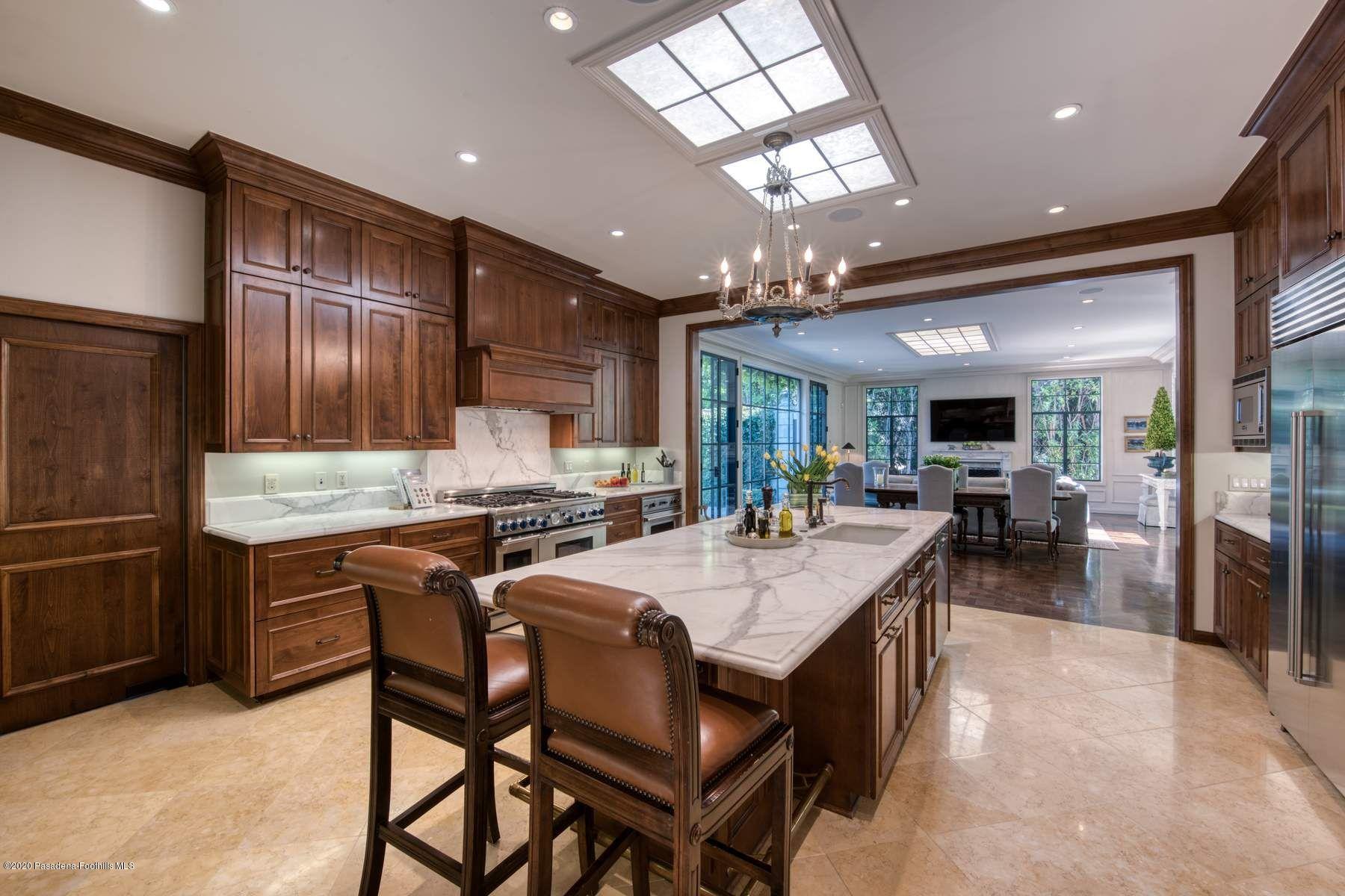 400 South San Rafael Avenue Pasadena, CA 91105 - Photo 13 of 49 a large kitchen with a table and chairs