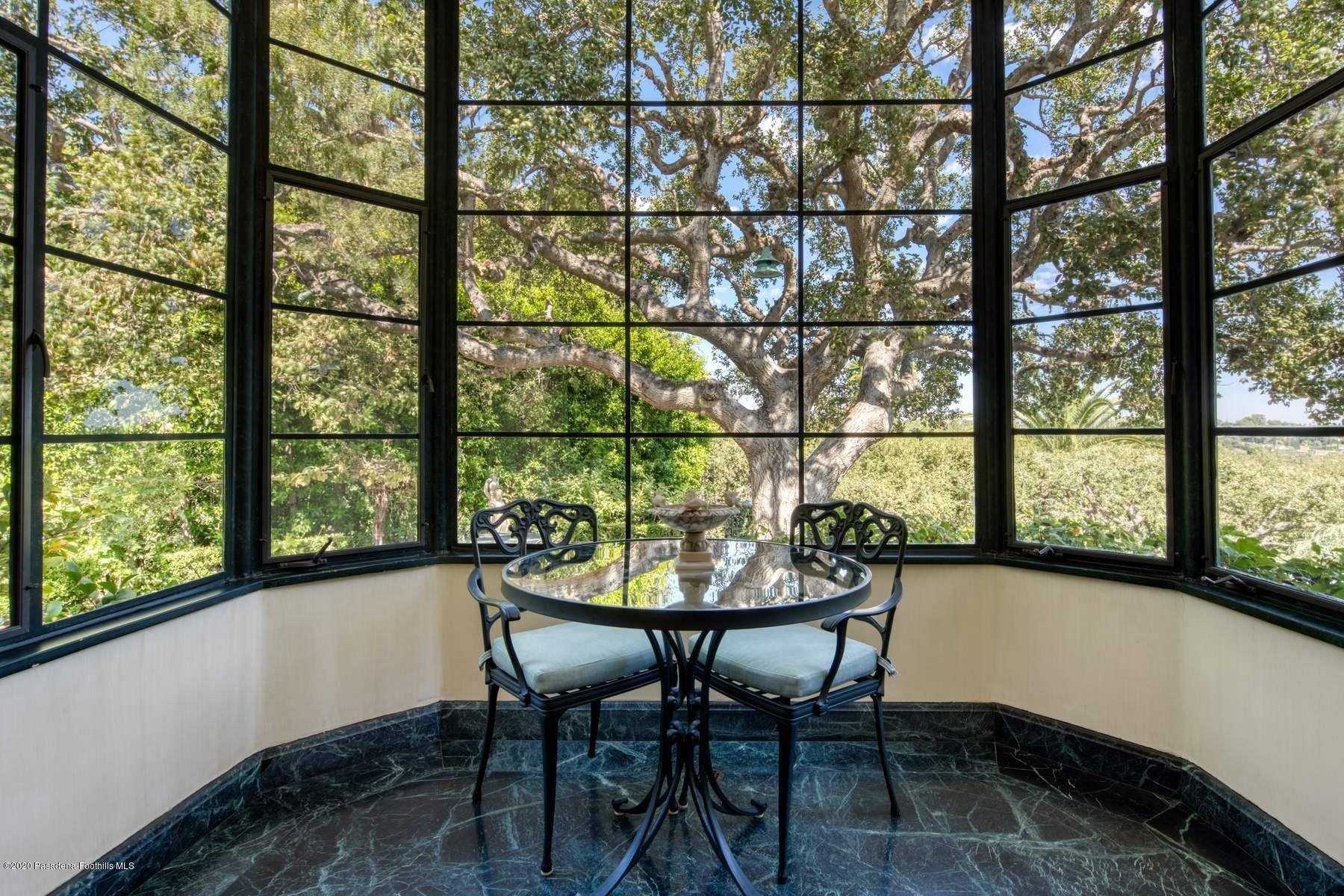 400 South San Rafael Avenue Pasadena, CA 91105 - Photo 18 of 49 a view of a room that has a table and chair in it