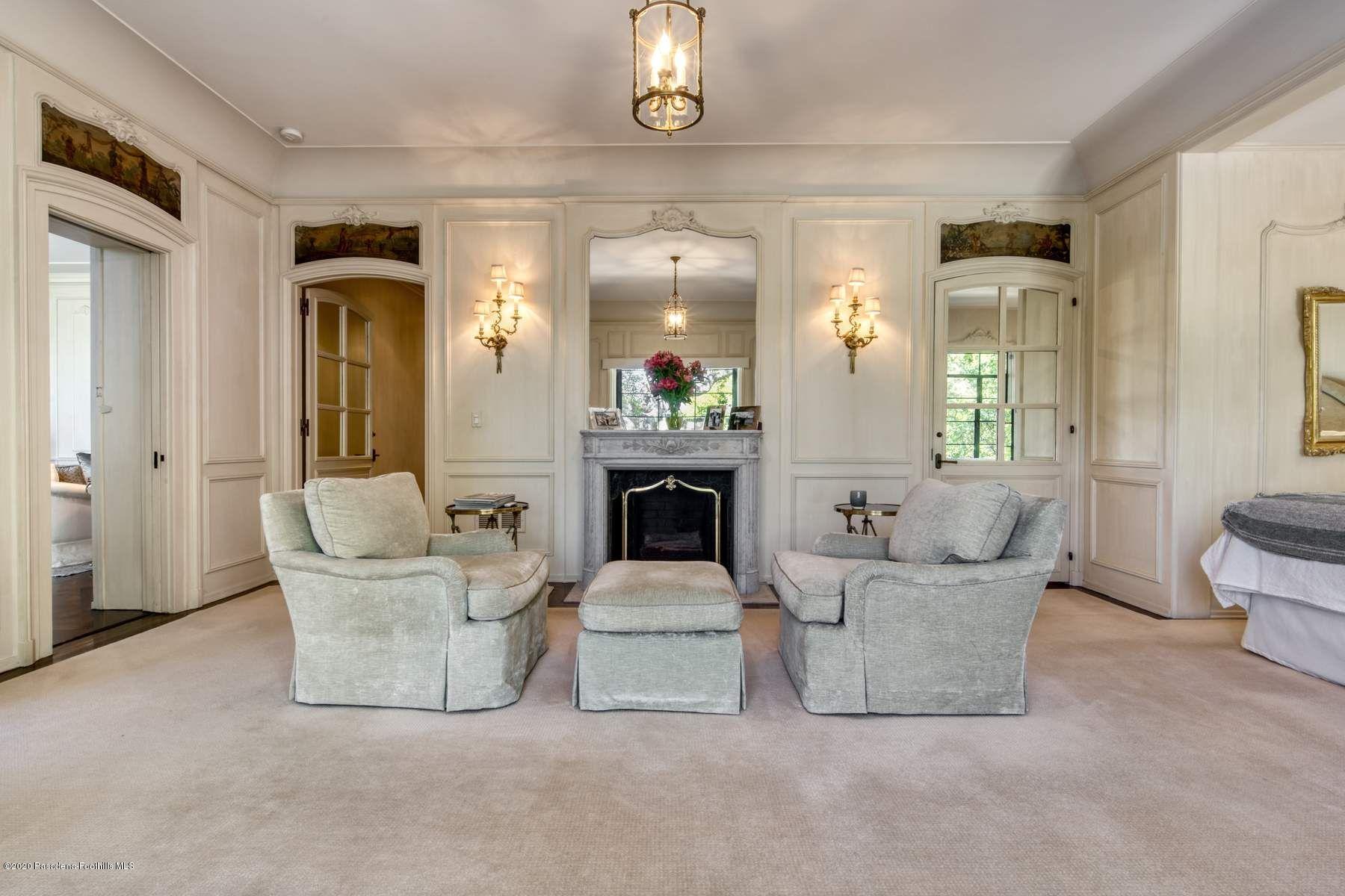 400 South San Rafael Avenue Pasadena, CA 91105 - Photo 20 of 49 a living room with furniture and a chandelier