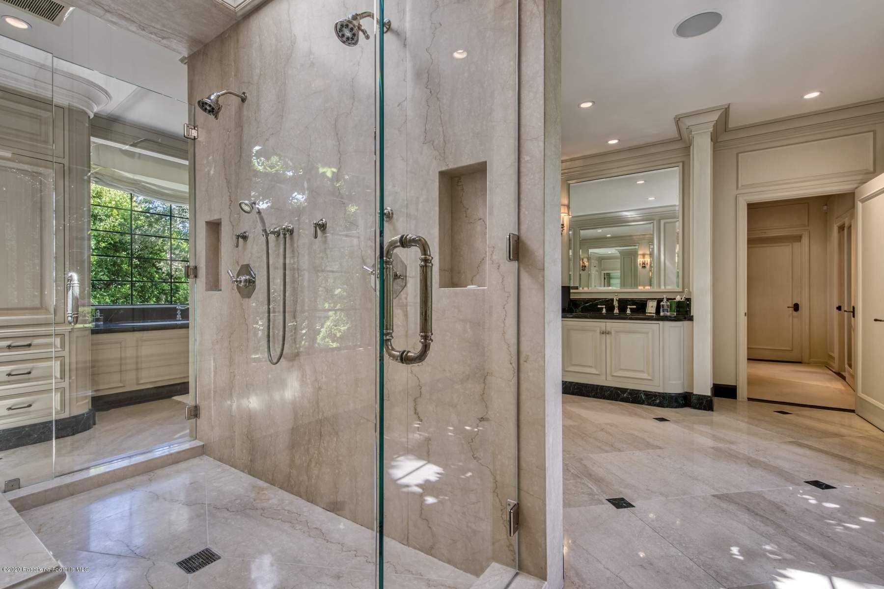 400 South San Rafael Avenue Pasadena, CA 91105 - Photo 22 of 49 a bathroom with a glass shower door and a sink