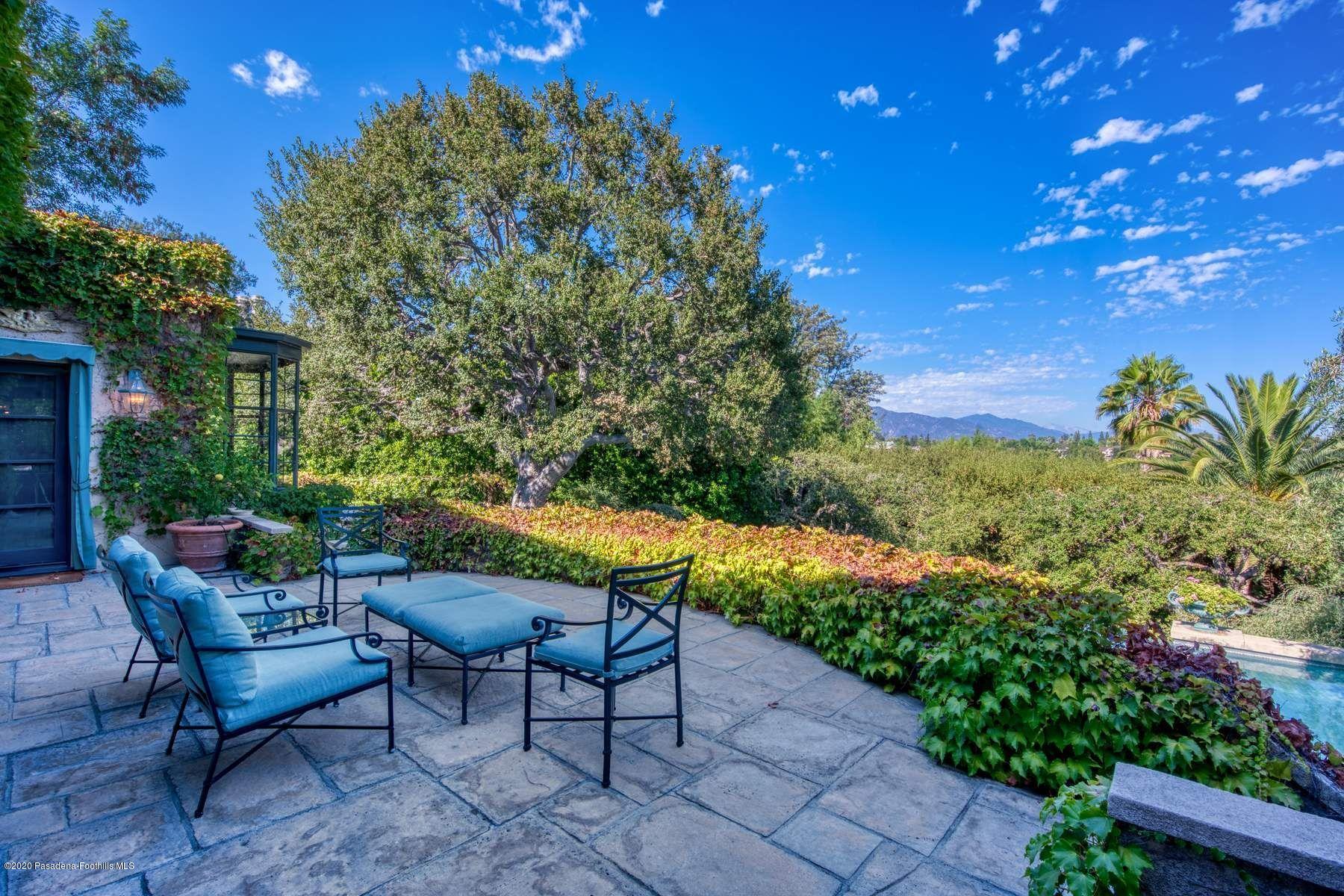 400 South San Rafael Avenue Pasadena, CA 91105 - Photo 33 of 49 a backyard of a house with table and chairs
