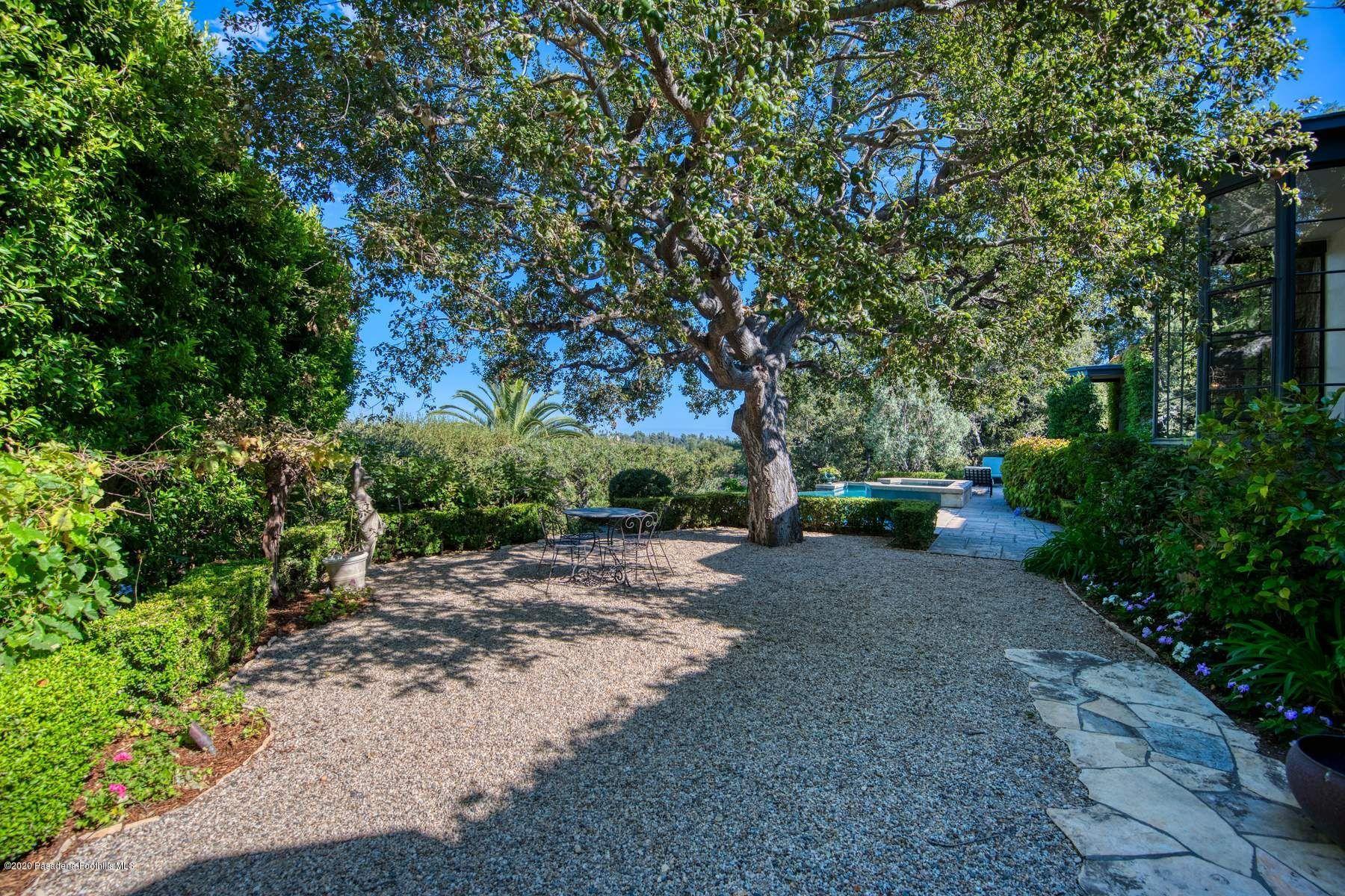 400 South San Rafael Avenue Pasadena, CA 91105 - Photo 36 of 49 a wooden bench with view of trees