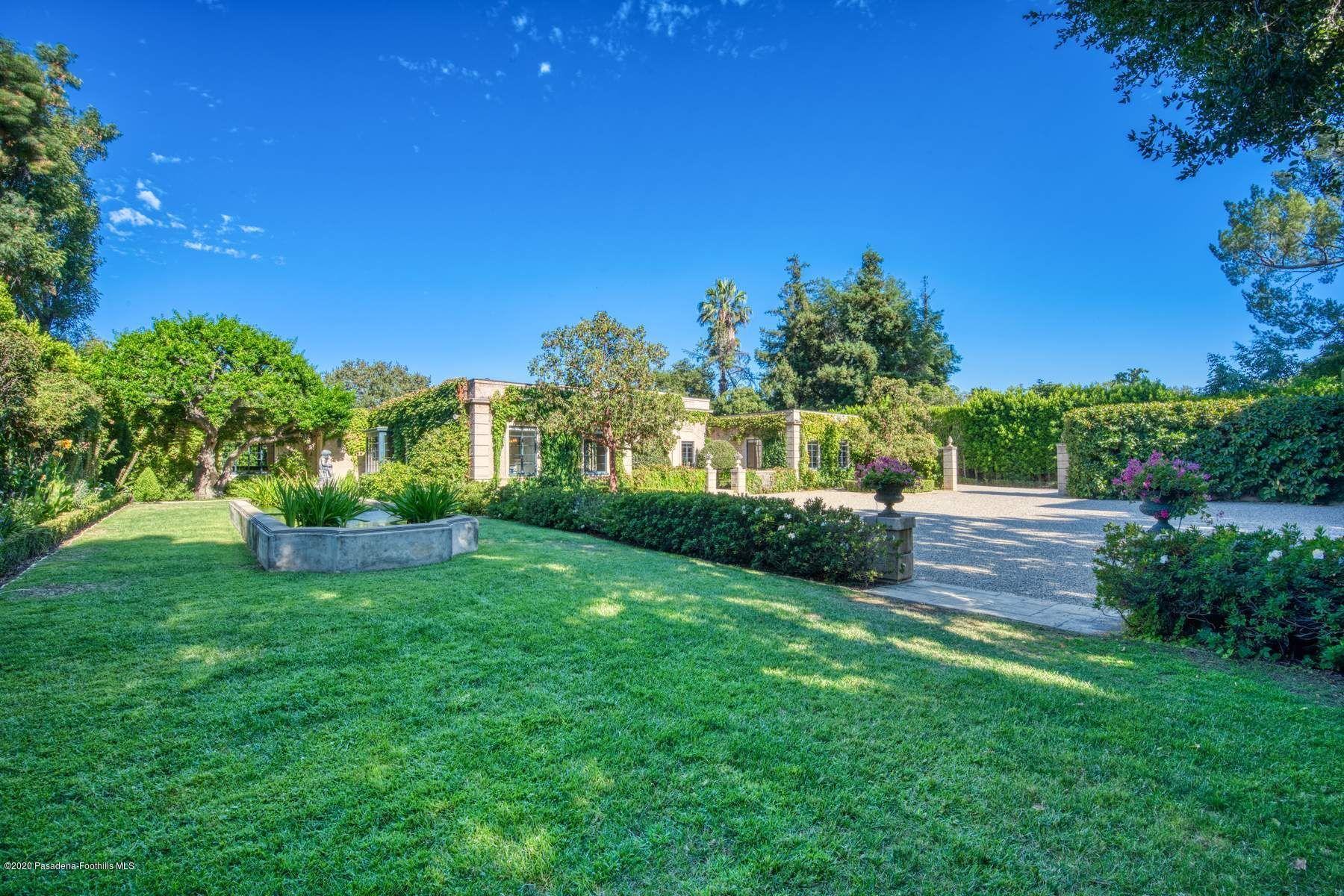 400 South San Rafael Avenue Pasadena, CA 91105 - Photo 44 of 49 a view of a garden with a building in the background