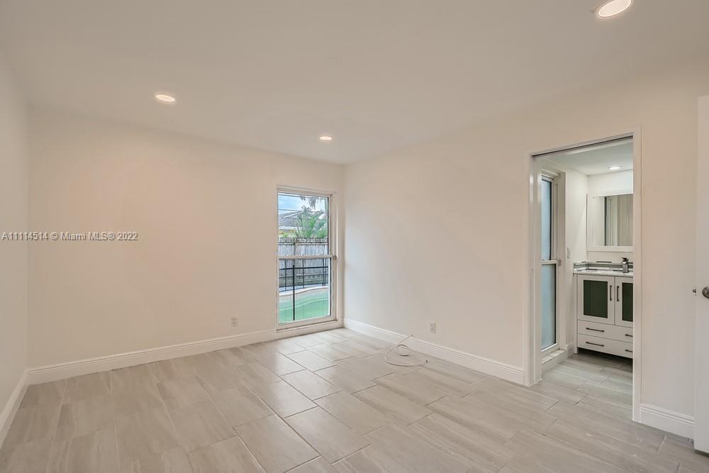 115 West Mango Road Lake Worth, FL 33467 - Photo 14 of 32 a view of an empty room with a window