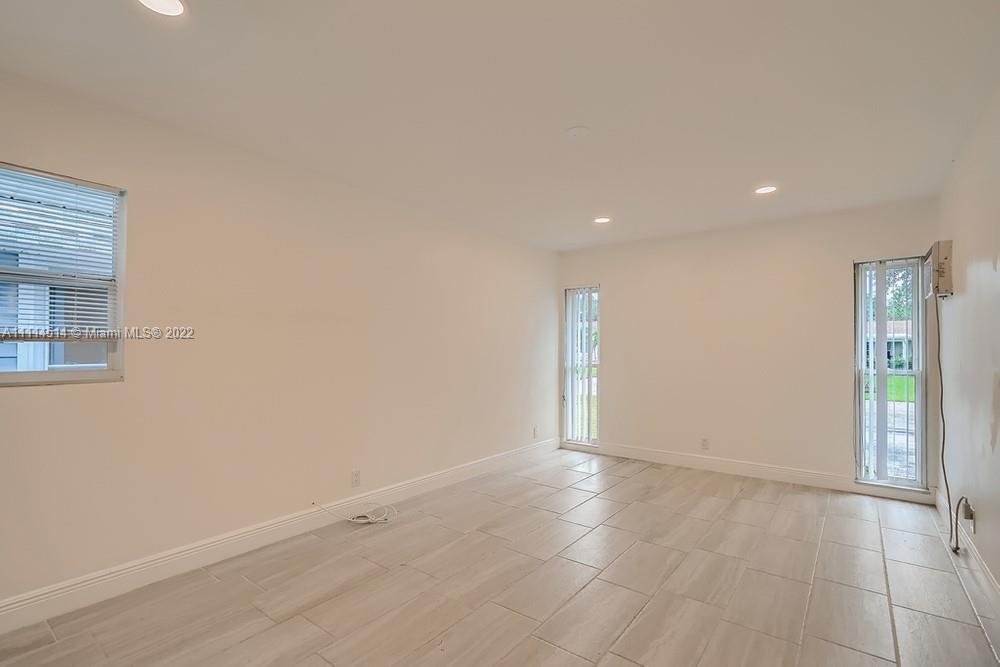 115 West Mango Road Lake Worth, FL 33467 - Photo 20 of 32 an empty room with entrance and windows