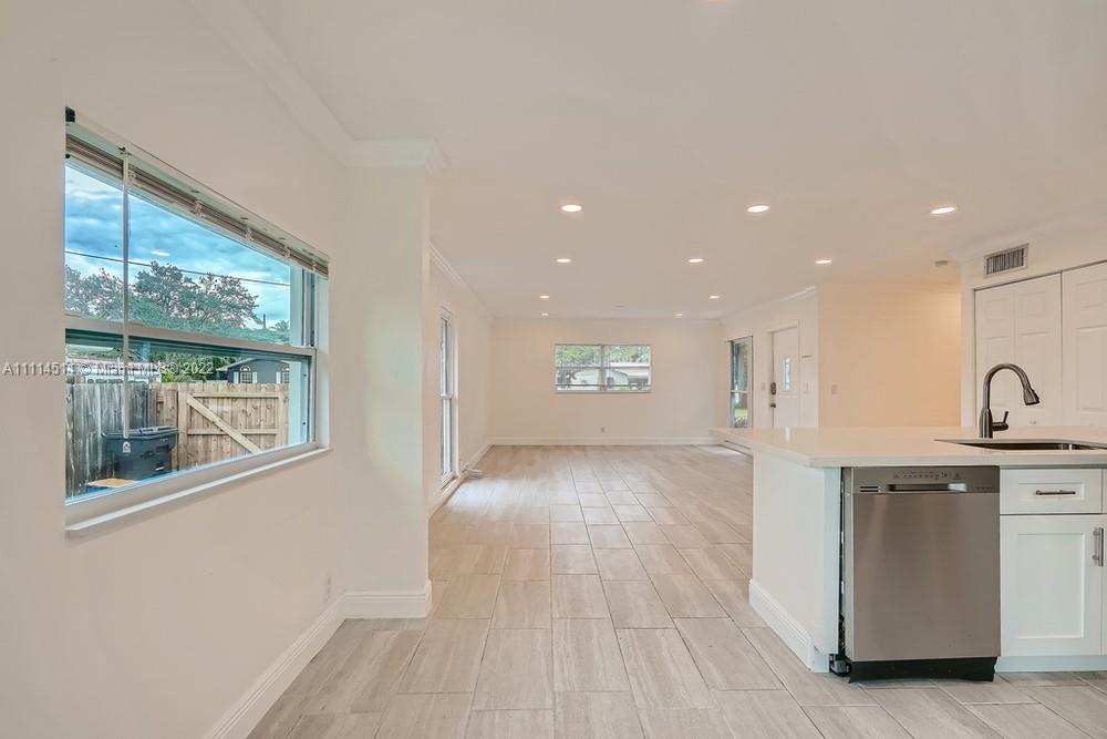 115 West Mango Road Lake Worth, FL 33467 - Photo 8 of 32 a view of a kitchen with a sink and a window
