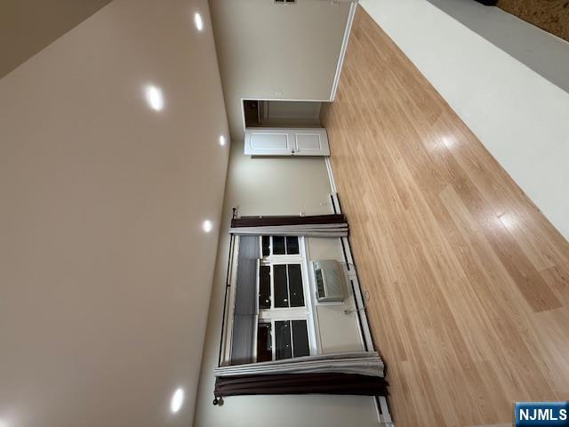 177 North Maple Avenue, Unit 177 Park Ridge, NJ 07656 - Photo 5 of 12 a view of empty room with wooden floor and windows
