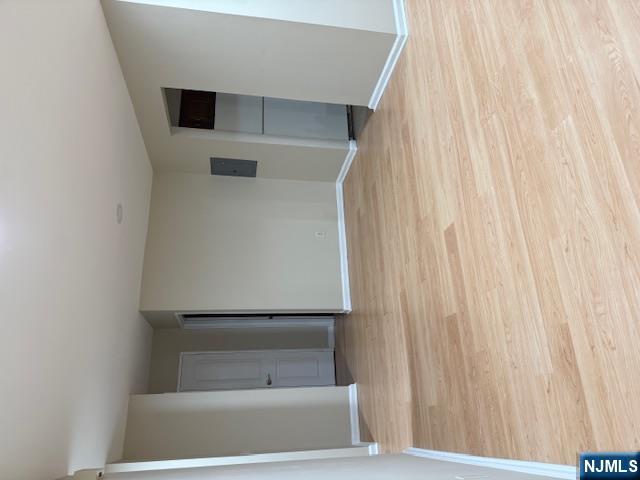 177 North Maple Avenue, Unit 177 Park Ridge, NJ 07656 - Photo 7 of 12 a view of empty room with wooden floor