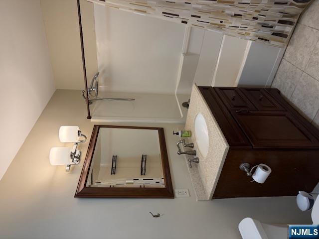 177 North Maple Avenue, Unit 177 Park Ridge, NJ 07656 - Photo 8 of 12 a bathroom with a sink vanity and a mirror