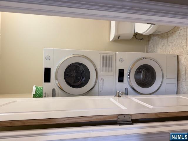177 North Maple Avenue, Unit 177 Park Ridge, NJ 07656 - Photo 9 of 12 a view of a bathroom with a washer and dryer