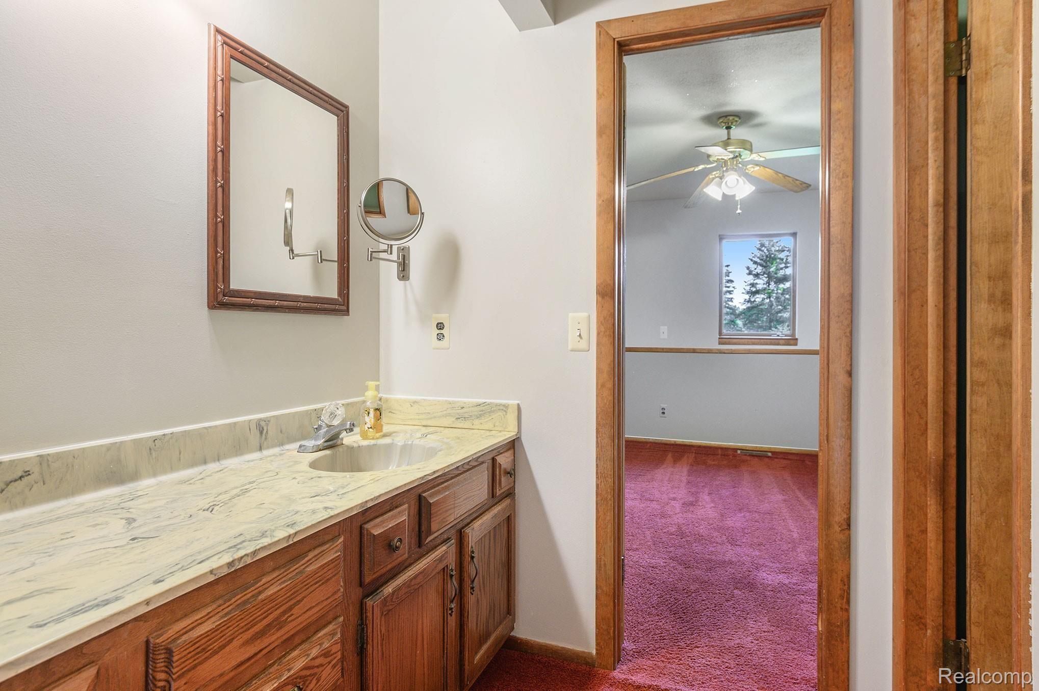2469 Academy Road Holly, MI 48442 - Photo 26 of 44 2 Entry Bathroom, Toilet and Shower through door on the right