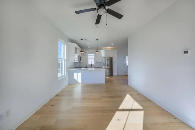 a view of a kitchen with a sink and cabinets