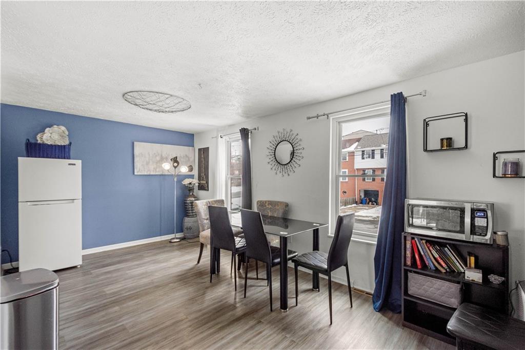 1731 Cliff Street Pittsburgh, PA 15219 - Photo 12 of 23 a view of a dining room with furniture and wooden floor