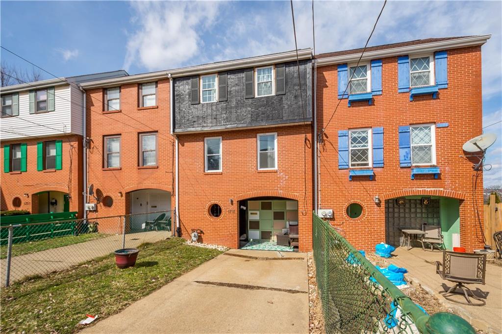 1731 Cliff Street Pittsburgh, PA 15219 - Photo 2 of 23 a front view of a house with a yard