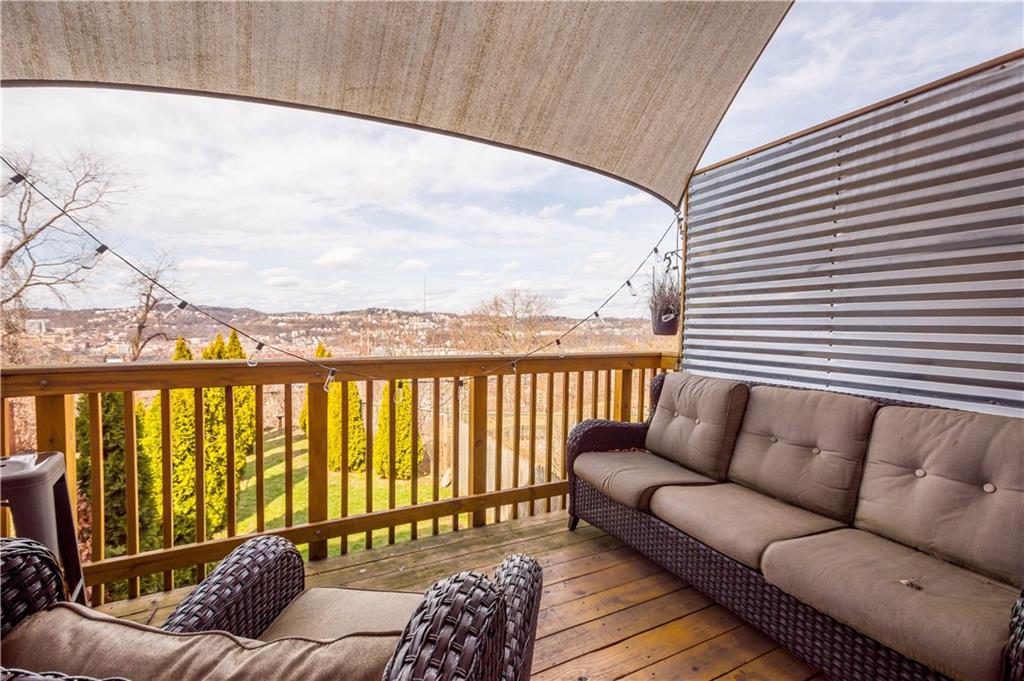 1731 Cliff Street Pittsburgh, PA 15219 - Photo 6 of 23 a balcony with furniture and a potted plant
