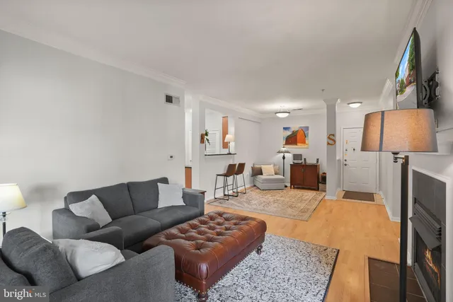 a living room with furniture and a lamp