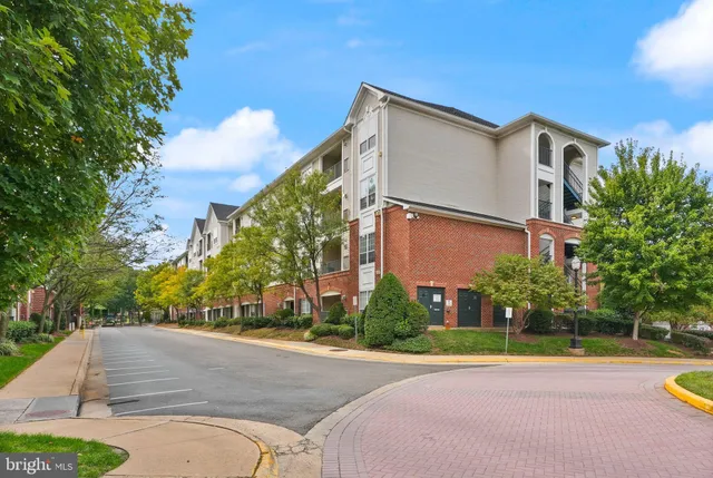 a view of a street with a building in the background