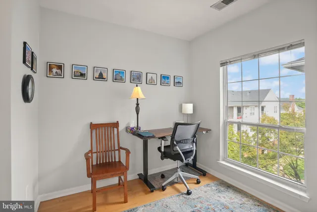 a vase of flowers sitting on a table in a living room
