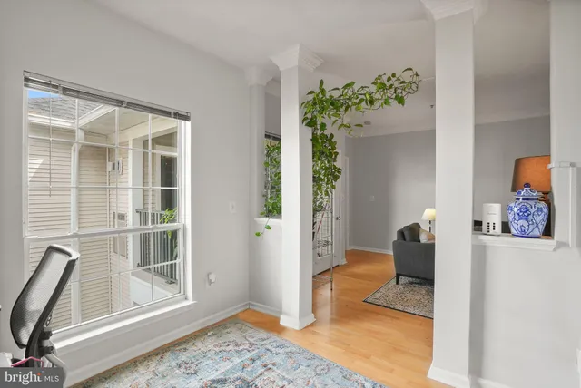a view of a livingroom with furniture and a window