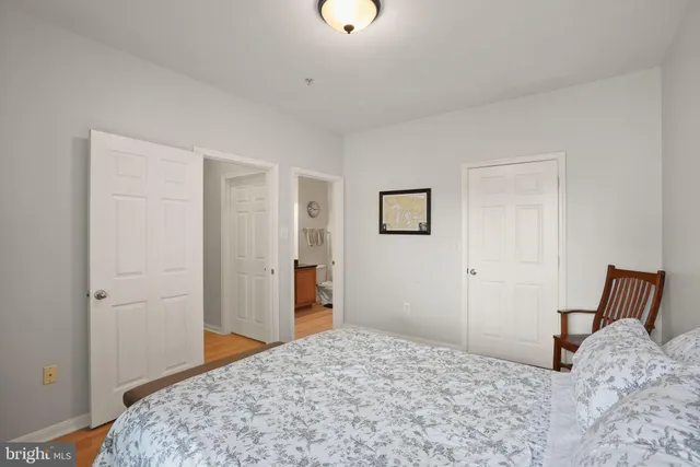 a bedroom with a bed and a dresser