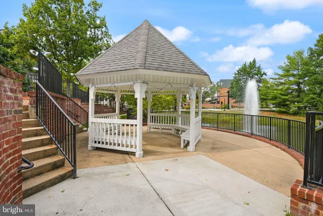 a view of park with bench and trees