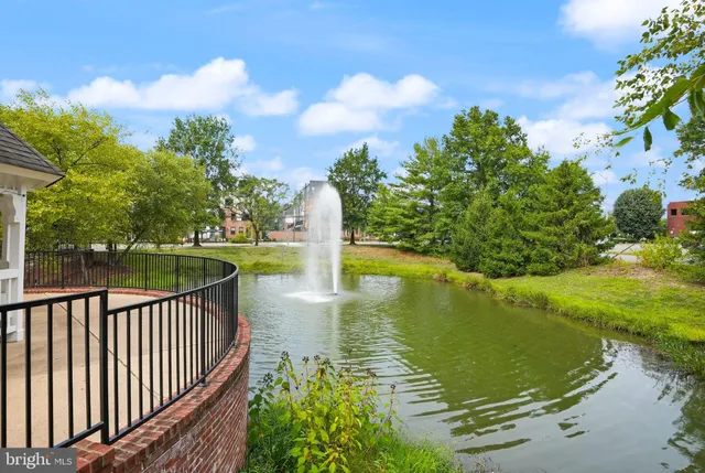 a view of backyard with deck and outdoor seating