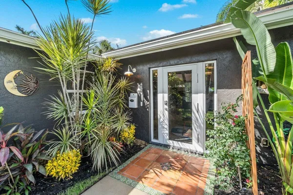 a kitchen with stainless steel appliances granite countertop a sink and cabinets