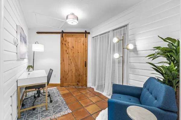 a view of a backyard with sitting area