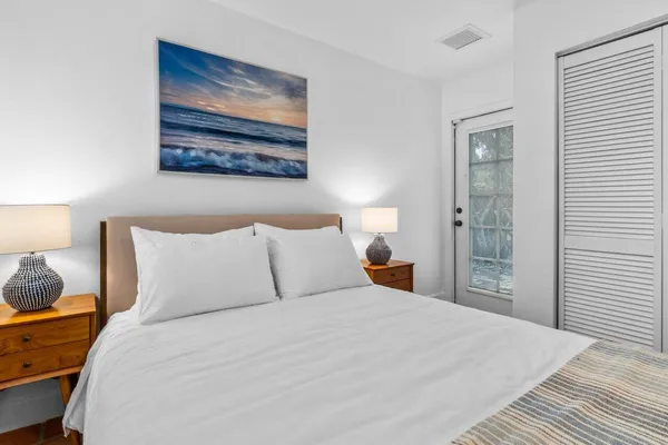 an aerial view of residential houses with outdoor space and street view