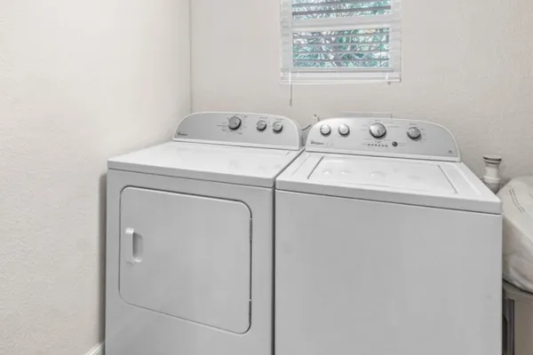 a view of a swimming pool with an outdoor space and seating area