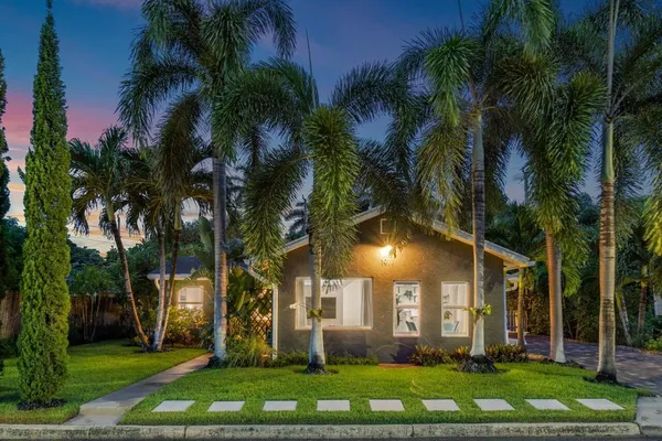 front view of a building with a garden