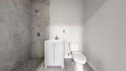 a bathroom with a sink and toilet