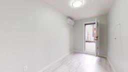 7902 16th Avenue Brooklyn, NY 11214 - Photo 15 of 17 a view of an empty room and window