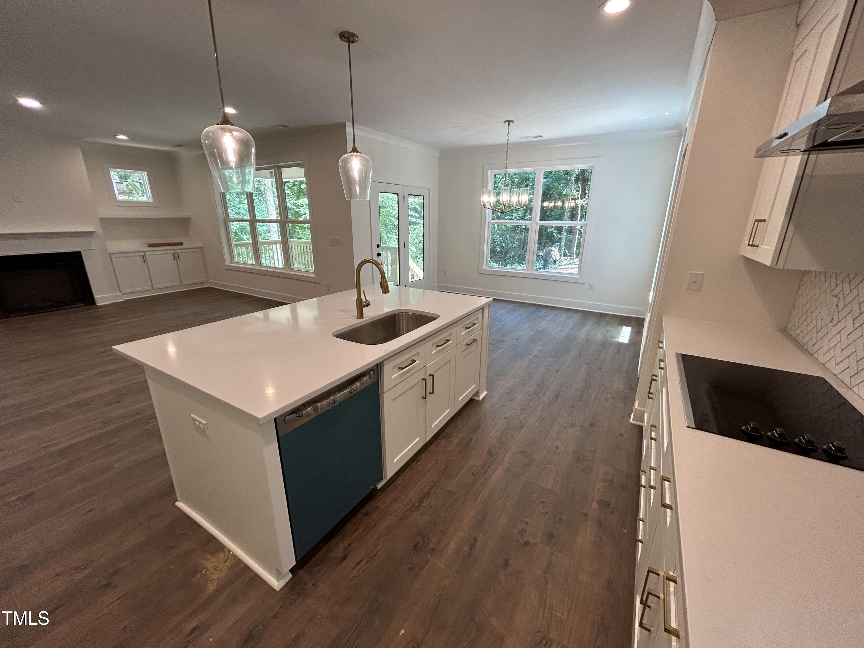 701 Locust Lane Raleigh, NC 27603 - Photo 5 of 19 a kitchen with a sink and wooden floor