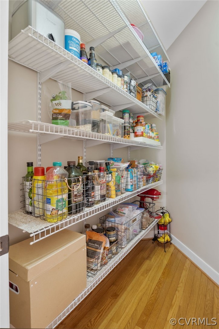 2713 Founders Bridge Road Midlothian, VA 23113 - Photo 15 of 49 a kitchen with white cabinets and a wooden floor