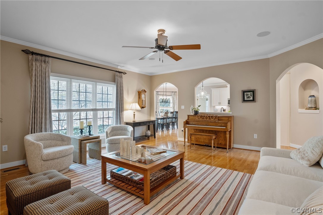 2713 Founders Bridge Road Midlothian, VA 23113 - Photo 19 of 49 a living room with furniture a fireplace and a chandelier