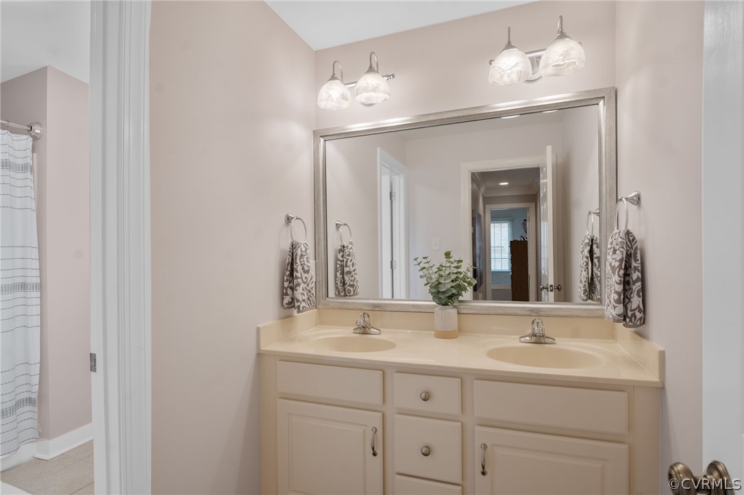 2713 Founders Bridge Road Midlothian, VA 23113 - Photo 28 of 49 a bathroom with double vanity and a mirror