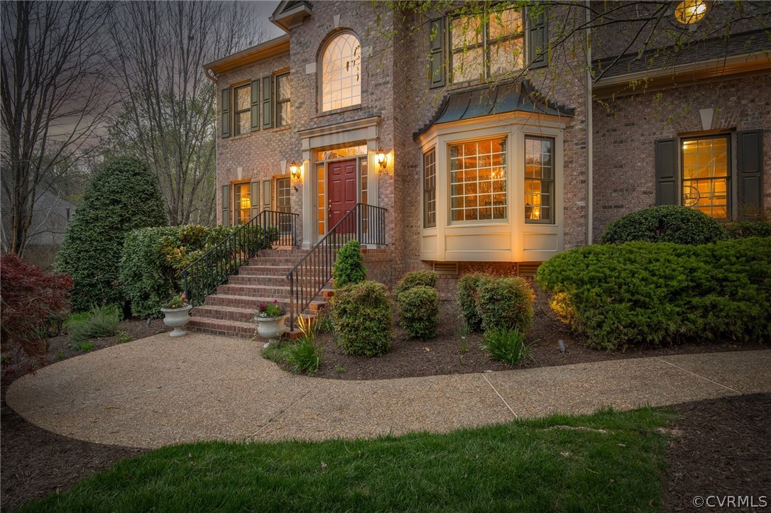 2713 Founders Bridge Road Midlothian, VA 23113 - Photo 4 of 49 a front view of a house with garden